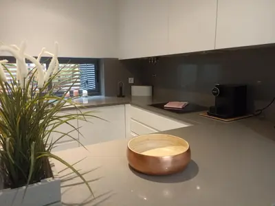 a kitchen with a wooden bowl on the counter at L Orangerie CA by Intiholidays in Vilamoura