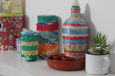 a group of colorful glass bottles on a counter at Casa das Andorinhas in Faro
