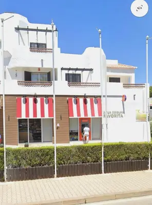 a white building with a fire hydrant in front of it at ExcelStay - Balaia in Albufeira