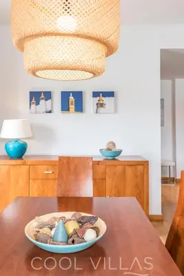 a dining room table with a bowl of shells on it at Marina Water View - 6 people, bars & restaurants in Albufeira