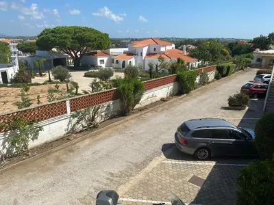 a car parked on the side of a road at Quinta Shiamar in Quarteira