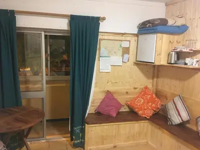 a room with a bench with pillows on it at Rua Fancisco Barreto in Faro