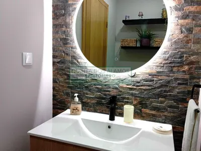 a bathroom with a sink and a mirror at Moradia Townhouse S Sebastião F in Guia
