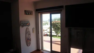 a room with a sliding glass door to a patio at Pool & Garden Oura Albufeira Flat in Albufeira