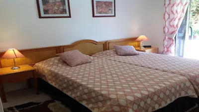 a bedroom with a bed with two pillows on it at Casa Esperança in Albufeira