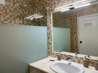 a bathroom with a sink and a mirror at RosaMar apartment sea view and pool in Albufeira
