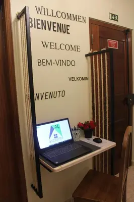 a laptop computer sitting on a desk in a room at Apartamento Lara in Albufeira