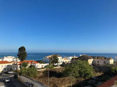 a view of a town with the ocean in the background at KAP Sea View Balcony in Albufeira
