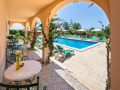 an external view of a resort with a swimming pool at Apartamentos Monte dos Avós, Albufeira by AlgarveBlossom in Albufeira