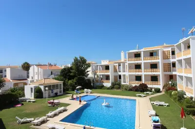 an image of a swimming pool in front of a building at Beauty by the Sea in Albufeira