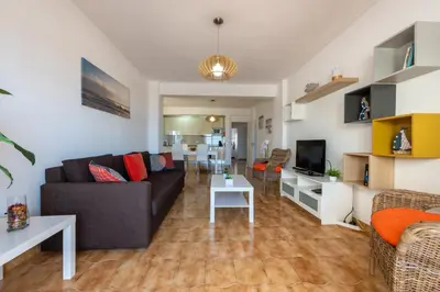 a living room with a couch and a table at Carol & Vany in Quarteira