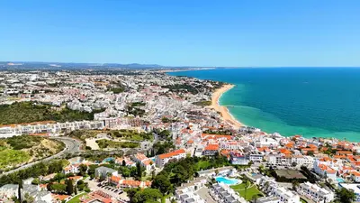 an aerial view of a city and the ocean at Modern Ocean, Garden & Pool view Condo by BeCherish in Albufeira