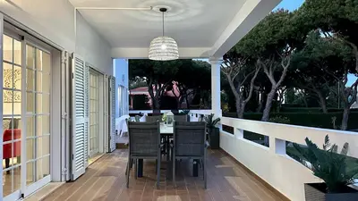 an outdoor dining room with a table and chairs at Fonte Santa by Check-in Portugal in Quarteira