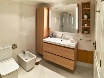 a bathroom with a sink and a toilet at Casa beira mar Algarve in Albufeira