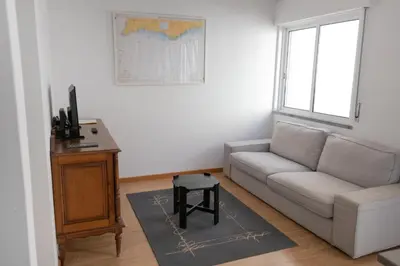 a living room with a couch and a table at Casa Gago in Faro