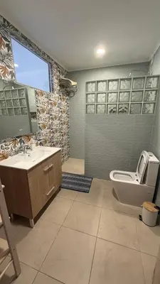 a bathroom with a sink and a toilet and a tub at Vista Mar 2 in Albufeira