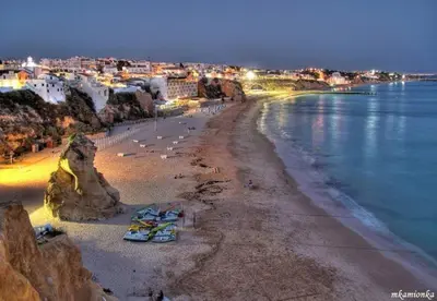 a beach with a group of people and the water at Edifício Albufeira 406 in Albufeira