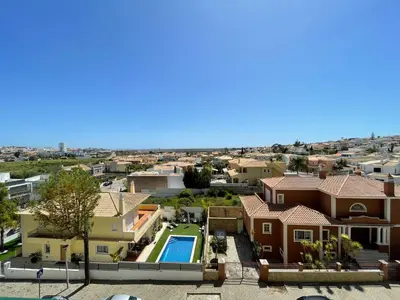 an aerial view of a house with a swimming pool at Your place in Faro in Faro