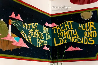 a book with the words where youre your friends and your family are like at Hostel Casa d'Alagoa in Faro