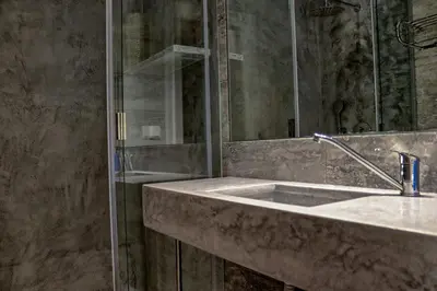 a bathroom with a sink and a shower at Casa da Palmeira, pool & soccer pitch in Vilamoura