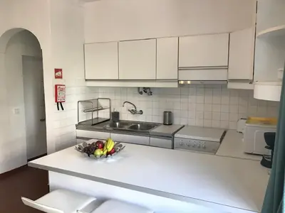 a kitchen with a bowl of fruit on a counter at BREEZY NEST by ITHOUSE in Albufeira