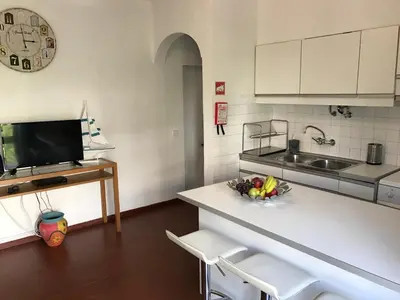 a kitchen with a counter with a bowl of fruit on it at BREEZY NEST by ITHOUSE in Albufeira