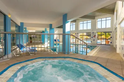 a large swimming pool in the middle of a house at Panoramic Sea View 1 Bedroom Apartment in Albufeira