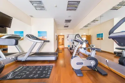 a gym with treadmills and elliptical machines at Lakeside Country Club - Apartamentos Turísticos in Quinta do Lago
