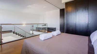 a bedroom with a bed with a glass case on it at Monte Laguna Duplex - Greice Homes in Vilamoura