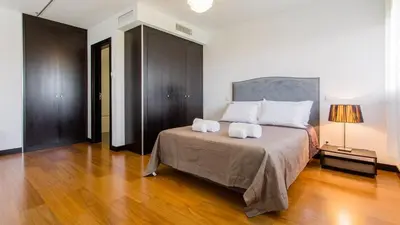 a bedroom with a bed with two pillows on it at Monte Laguna Duplex - Greice Homes in Vilamoura
