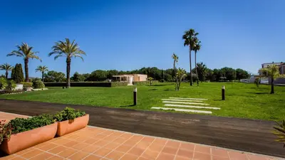 a park with palm trees and a field of grass at Monte Laguna Duplex - Greice Homes in Vilamoura