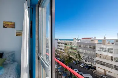 a view of a city street from a window at Vita Portucale ! Quarteira Sea View in Quarteira