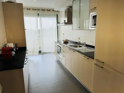 a kitchen with a sink and a counter top at Marina Vilamoura - Aquamar 320 by Vilamoura Sun in Vilamoura