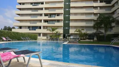 a large swimming pool in front of a building at Marina Vilamoura - Aquamar 320 by Vilamoura Sun in Vilamoura