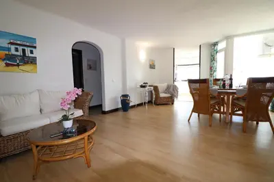 a living room with a couch and a table at Santa Eulalia Mar in Albufeira