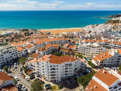 an aerial view of a city and the beach at Casa Cerro Branco in Albufeira