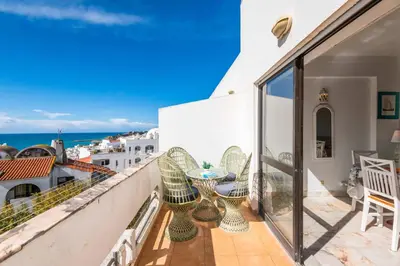 a balcony with a view of the ocean at Casa Cerro Branco in Albufeira