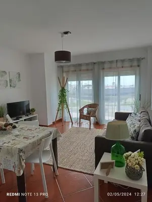 a living room with a couch and a table at Balcony View Albufeira in Albufeira