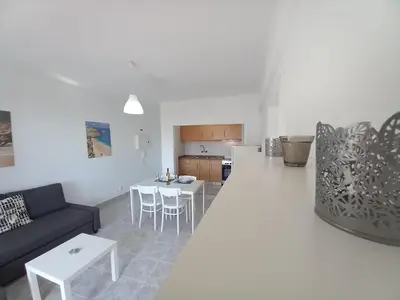 a living room with a couch and a table at Torre Azul 11 Vista Panoramica in Quarteira
