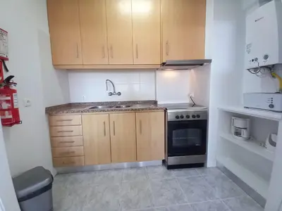 a small kitchen with a sink and a stove at Torre Azul 11 Vista Panoramica in Quarteira