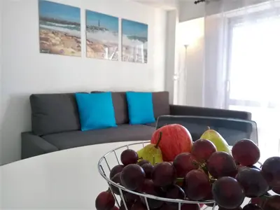 a bowl of fruit on a table in a living room at TORRE 14 Vista Magnifica in Quarteira