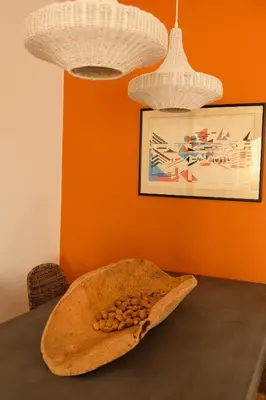 a table with a bowl of nuts on it at Yellow House - Checkinhome in Boliqueime