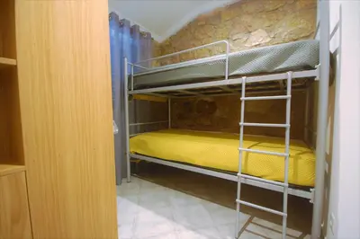 a bedroom with two bunk beds in a room at Vila Baltum - Free private parking - Wifi - Airco # by bedzy # in Albufeira