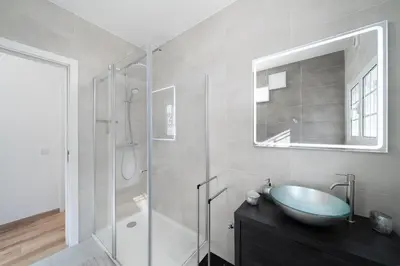 a bathroom with a sink and a glass shower at Exclusive Villa Toulouse with pool in Falesia Algarve in Albufeira