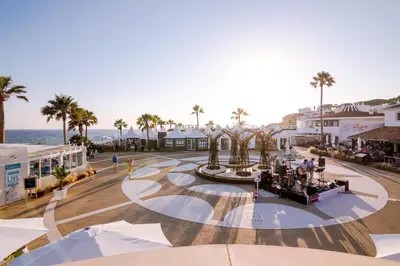 an aerial view of a town with palm trees and the ocean at Villa V1 Vale do Lobo Beach in Vale do Lobo