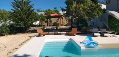 a swimming pool with a blue dolphin in a yard at FIND Your Space Casa no Campo - Paderne - Albufeira - Piscina Privada - Aquecida a pedido in Paderne