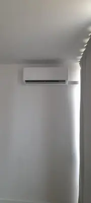 a ceiling vent in a room with a white wall at Hello Chloé in Vilamoura