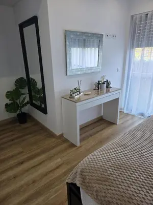 a white bathroom with a sink and a mirror at Cavalo Preto Luxury Beach Resort - C201 in Quarteira