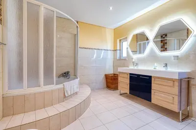 a bathroom with a tub and a sink and a shower at Full private 300sqm Villa Jacuzzi Heated Pool Ideal & quiet location in Albufeira