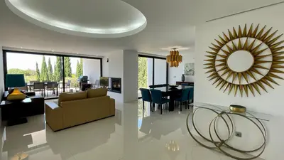 a living room with a couch and a mirror at Passion by Check-in Portugal in Albufeira